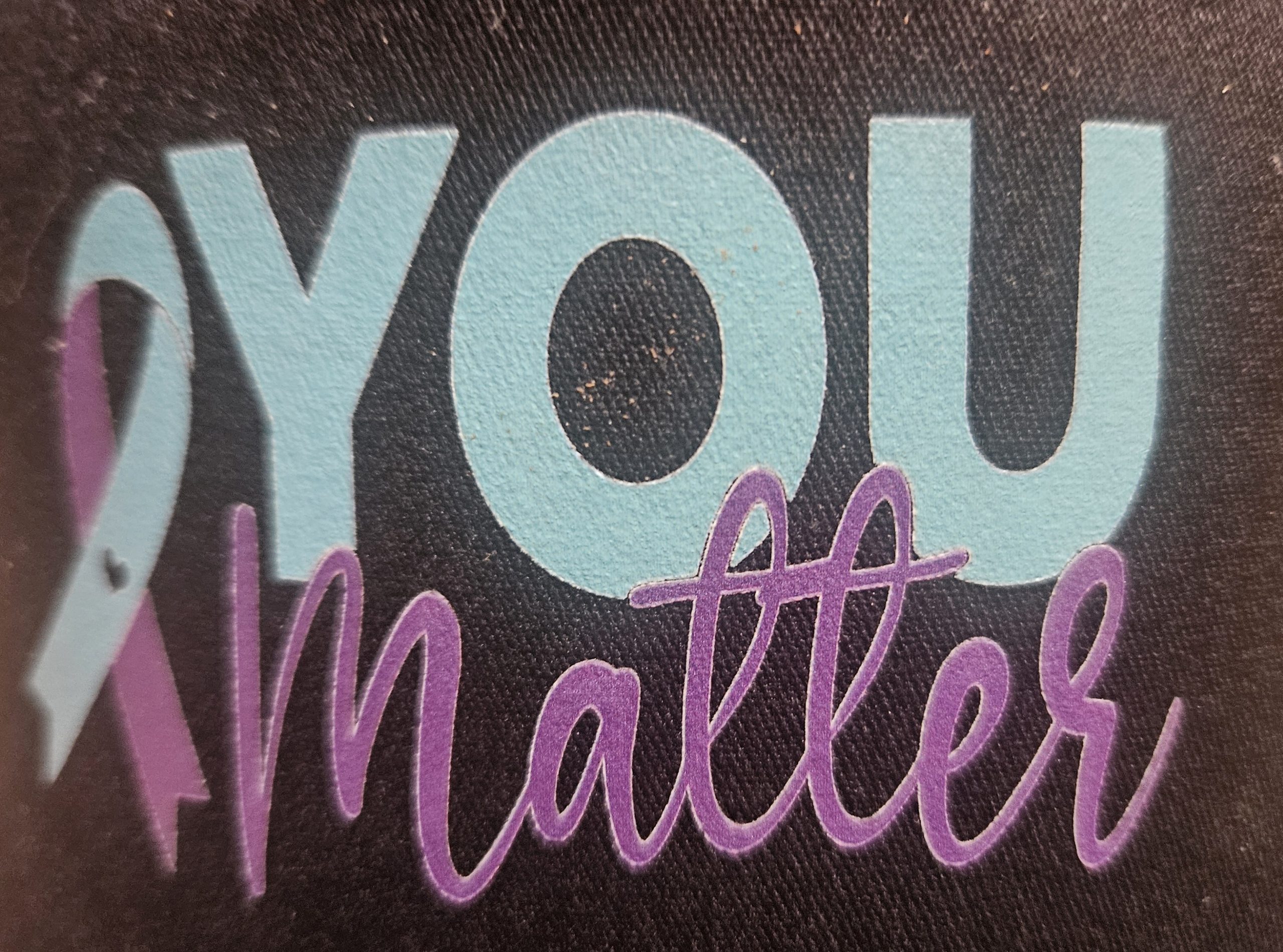 "You Matter" trucker hat, with 2026's official Suicide Prevention Awareness ribbon. Please see anyone with this hat if you have any questions at the event on 9/5/2026.